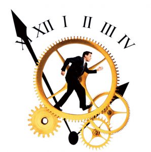 Businessman running on clock gears